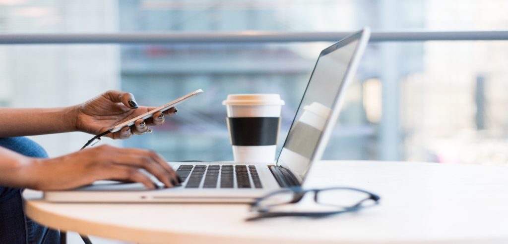 Laptop being used for digital marketing at a coffee shop